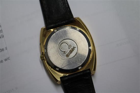 A gentlemans gold plated and steel Omega megaquartz wrist watch.